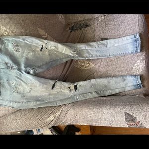 Size 28 Thrt denim jeans. Navy blue covers on rips